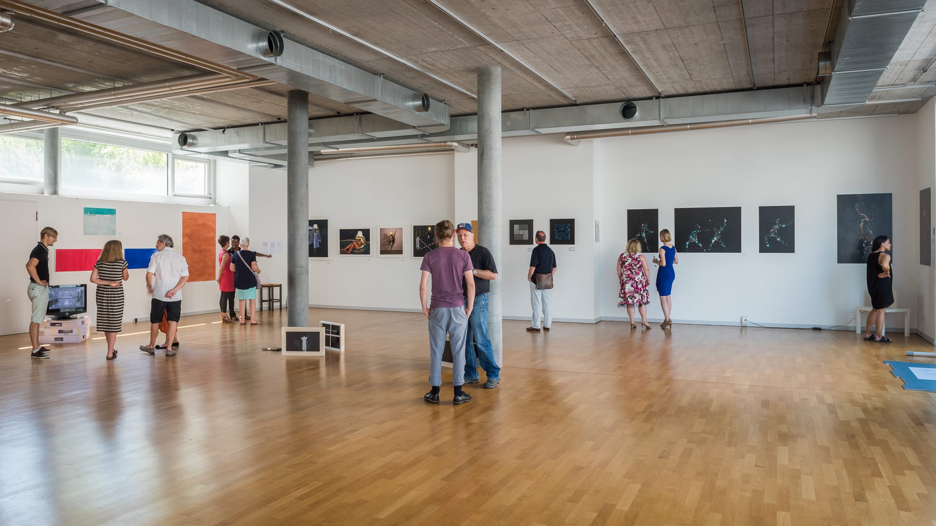 Visitors exploring the art exhibition in the original BAC studio in June 2017